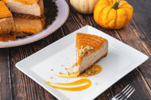Cotati Food Service Delicious Pumpkin Cheesecake In White Plate On Wooden Table